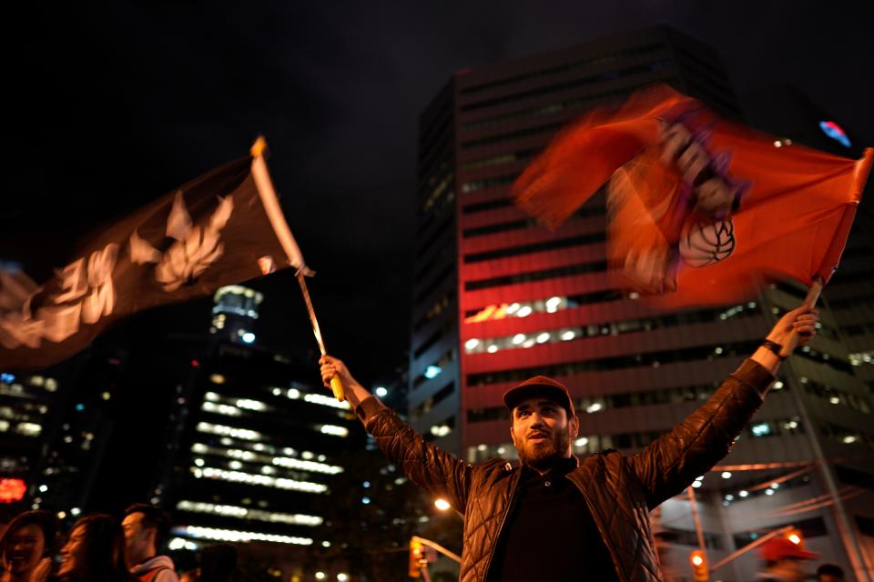 Toronto Raptors fans celebrate their win in the NBA championships in downtown Toronto, Ontario on early June 14, 2019. (Photo by Geoff Robins / AFP) (Photo credit should read GEOFF ROBINS/AFP/Getty Images)