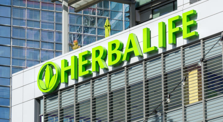 Herbalife (HLF) sign on top of a white building
