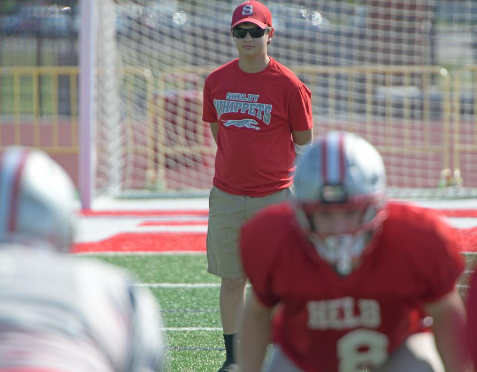 Alex Bushey watches practice Wednesday afternoon.