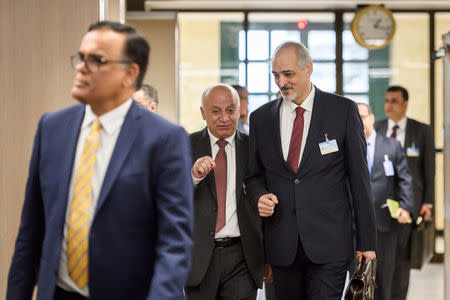 Syrian ambassador to the United Nations and head of the government delegation Bashar al-Jaafari (R) and his delegation arrive for a meeting with the UN Special Envoy for Syria during Intra Syria peace talks at the U.N. in Geneva, Switzerland December 14, 2017. REUTERS/ Fabrice Coffrini/Pool