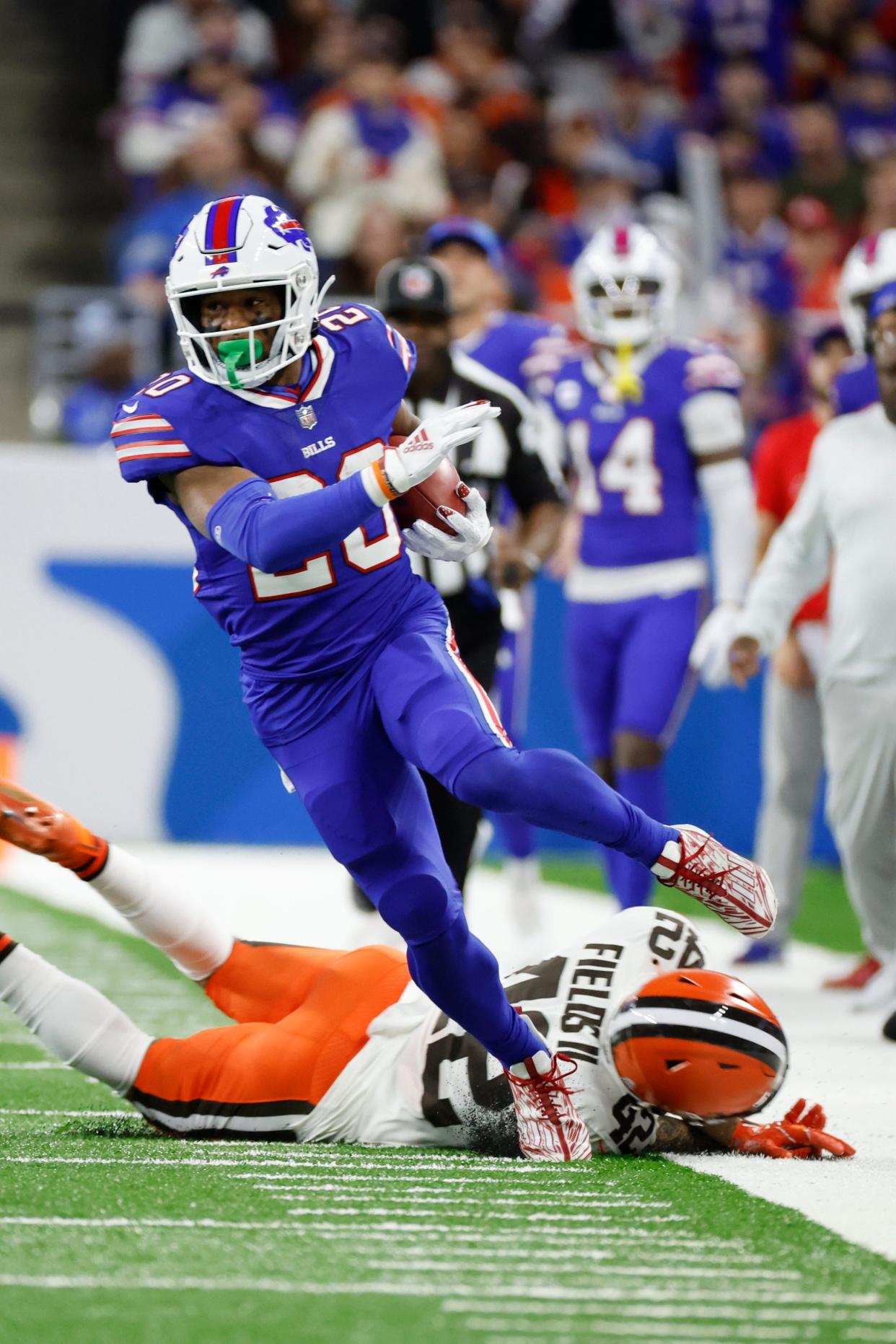 Buffalo Bills running back Nyheim Hines (20) runs the ball on a kick return against the Cleveland Browns on Nov. 20, 2022, in Detroit.