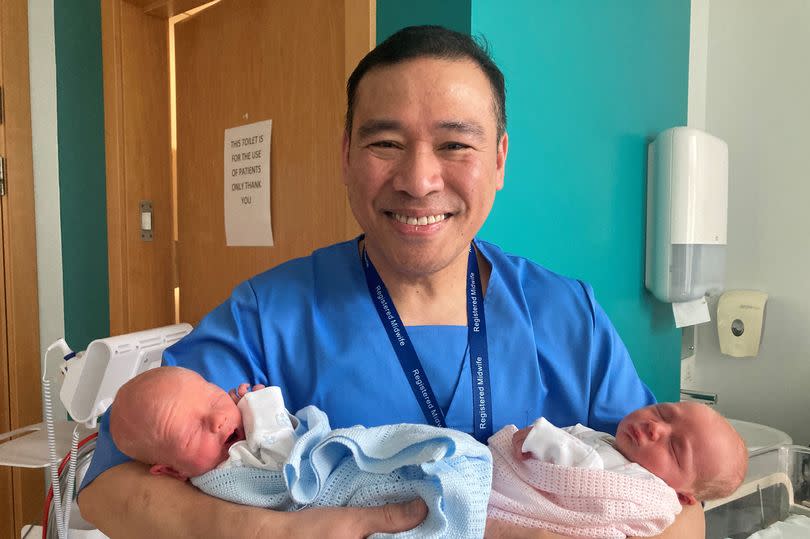 Midwife Vince Rosales with twins Aoife and Shea McGorrian