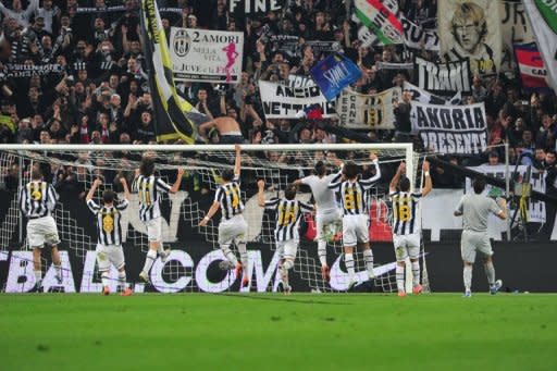 Juventus players celebrate after beating Inter Milan 2-0 on Sunday in Serie A to keep the heat on leaders AC Milan