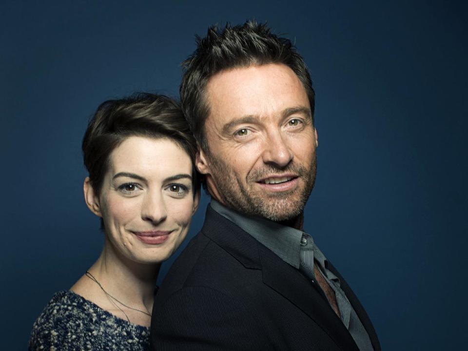 This Dec. 2, 2012 photo shows actors Anne Hathaway, left, and Hugh Jackman in New York. Hathaway portrays Fantine and Jackman portrays Jean Valjean in the film adaptation of the Victor Hugo novel, "Les Miserables." The film opens on Christmas Day. (Photo by Victoria Will/Invision/AP)