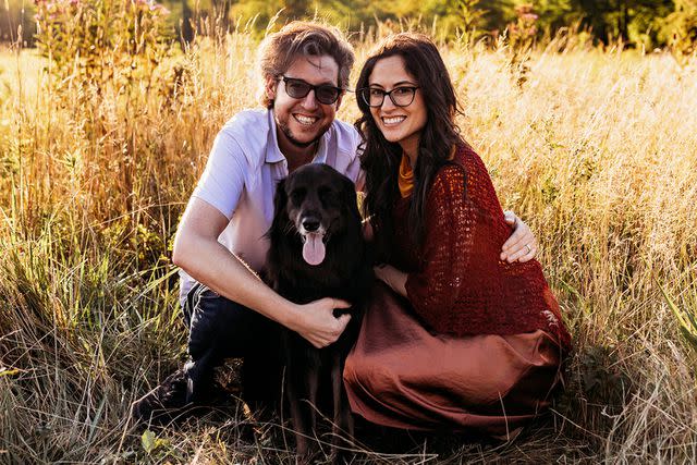 <p>Natalie Reyes Bursky</p> Magita the dog with Ryan Bursky (left) and Natalie Reyes Bursky