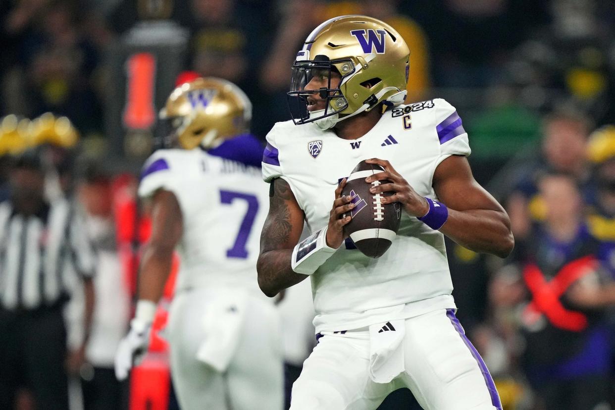 Jan 8, 2024; Houston, TX, USA; Washington Huskies quarterback Michael Penix Jr. (9) drops back to throws a pass during the second quarter against the Michigan Wolverines in the 2024 College Football Playoff national championship game at NRG Stadium. Mandatory Credit: Kirby Lee-USA TODAY Sports