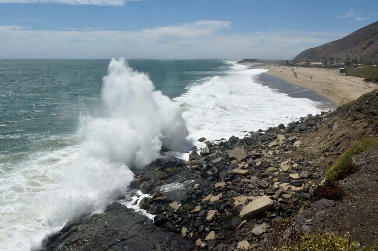 Water crashes over the rocks at Mugu State Beach.