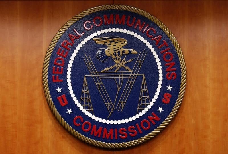 The Federal Communications Commission (FCC) logo is seen before the FCC Net Neutrality hearing in Washington February 26, 2015.  REUTERS/Yuri Gripas