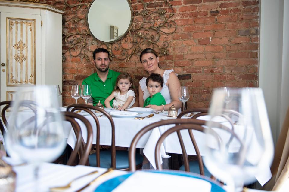 Richard Cusack, left, and Christina Cusack with their children Scarlett and Todd inside June BYOB in Collingswood.