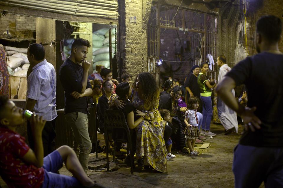 In this June 14, 2019 photo, two young women sit together during a party the night before a wedding in the predominantly Christian Manshiyat Nasser area of Cairo. Egypt’s legal system grants the Coptic church full authority over personal status matters of Copts, namely marriage and divorce. But the church does not have the same powers over its followers’ inheritance rights. (AP Photo/Maya Alleruzzo) (AP Photo/Maya Alleruzzo)