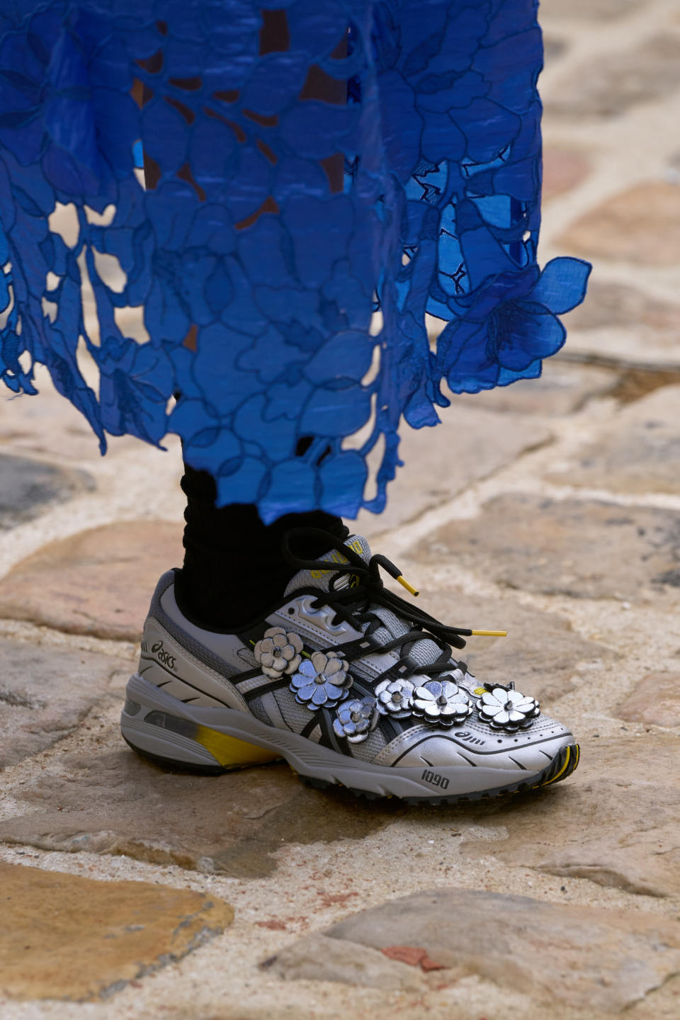 Embellished Asics sneakers at Cecilie Bahnsen spring summer ’23. - Credit: Alessandro Viero/Courtesy of Cecilie Bahnsen