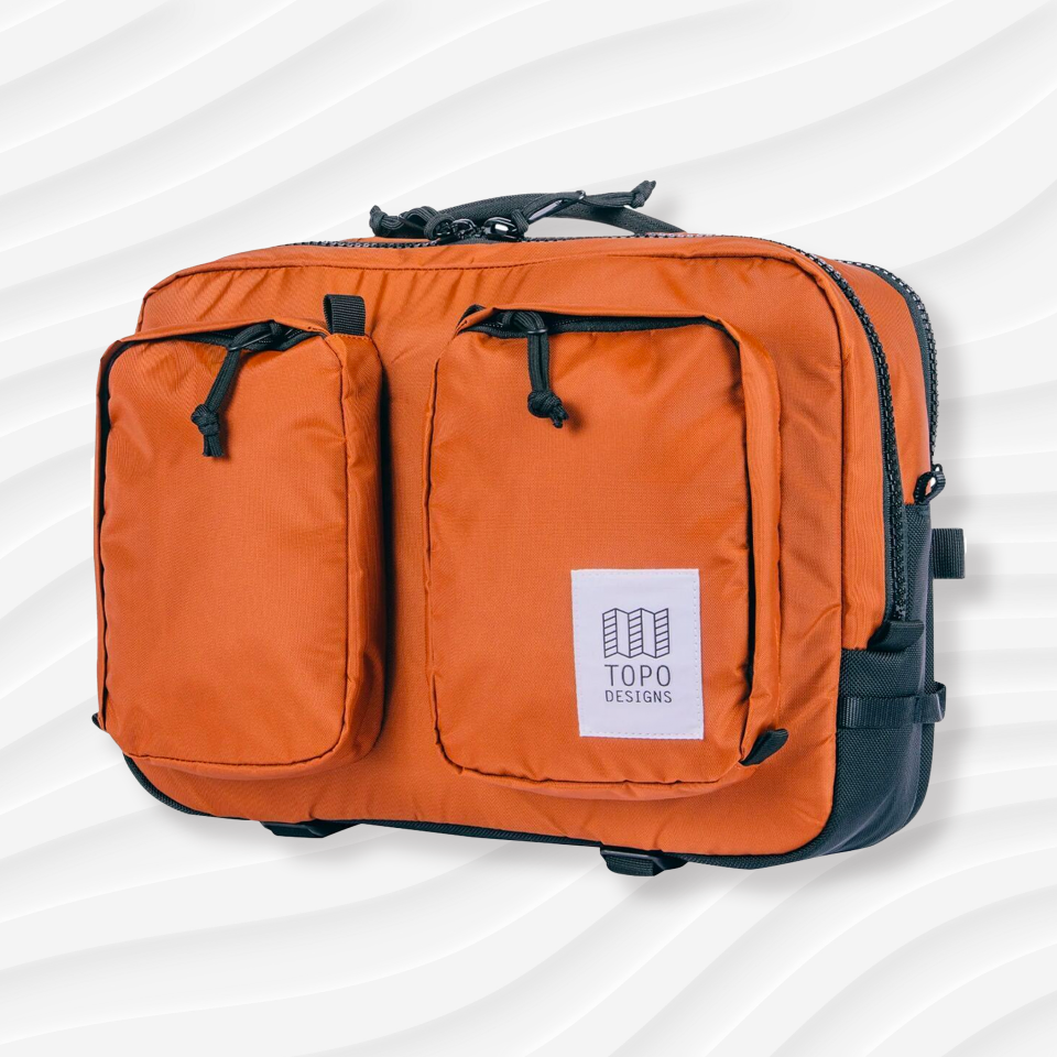 the topo designs global briefcase in orange