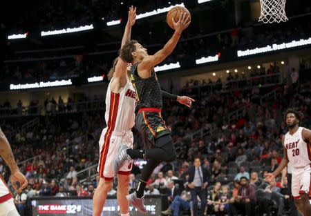 Nov 3, 2018; Atlanta, GA, USA; Atlanta Hawks guard Trae Young (11) shoots against the Miami Heat in the third quarter at State Farm Arena. Brett Davis-USA TODAY Sports