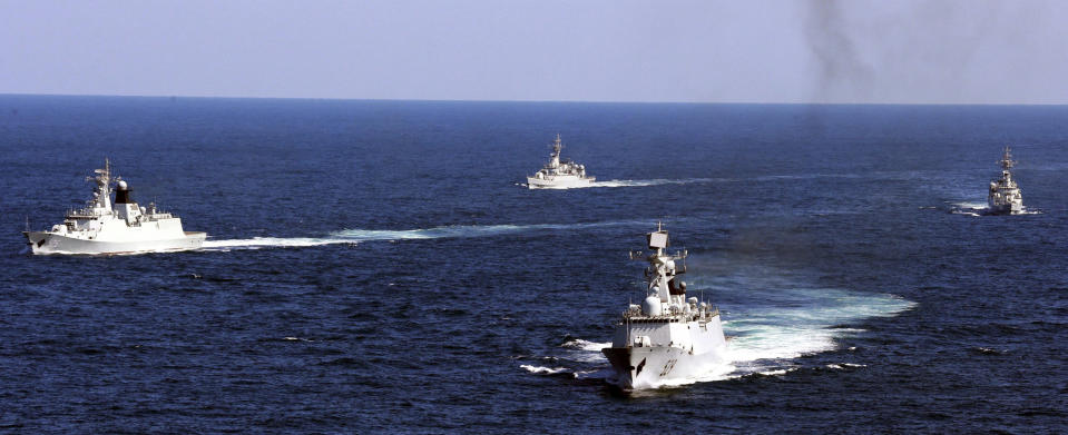 FILE - In this Oct. 19, 2012, file photo, Chinese navy vessels take part in a drill in the waters off Zhoushan in east China's Zhejiang province. China says it will increase its defense spending by 6.6% in 2020, despite a major downturn in the country's economic growth due to the coronavirus outbreak. (AP Photo, File)