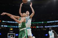 Boston Celtics' Jordan Walsh (27) and Charlotte Hornets' Aleksej Pokusevski (17) battle for a rebound during the first half of an NBA basketball game, Friday, April 12, 2024, in Boston. (AP Photo/Michael Dwyer)