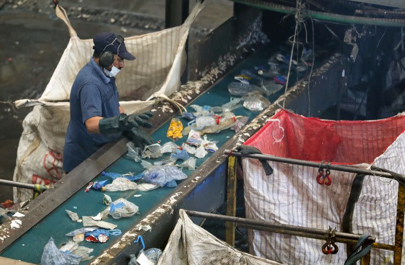 A worker is seen at a recycling factory, which recycles plastic garbage collected from the Nile river, in Giza