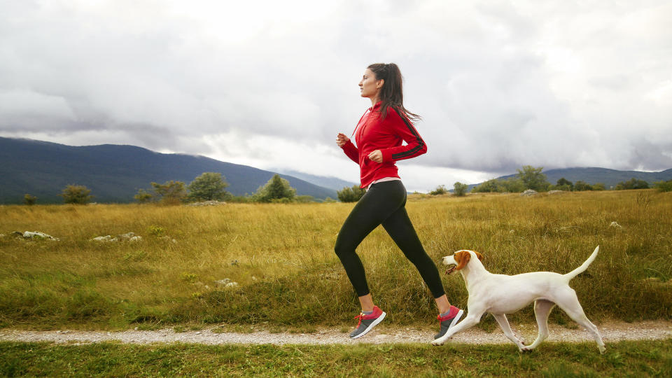 Woman running with her dog