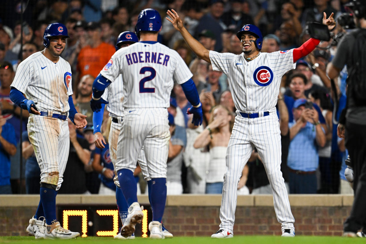 The Chicago Cubs have managed to turn around their season thanks to big contributions from players like Nico Hoerner (2), Mike Tauchman (left) and more. (Photo by Quinn Harris/Getty Images)