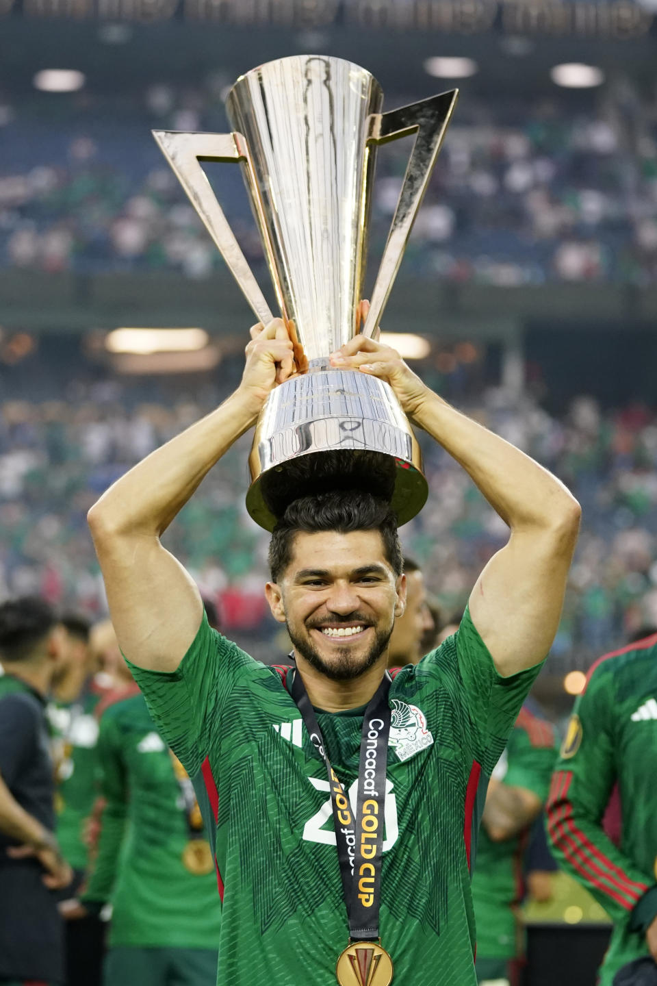 Mexico's Henry Martin lift the winner's trophy after beating Panama 1-0 in the CONCACAF Gold Cup final soccer match Sunday, July 16, 2023, in Inglewood, Calif. (AP Photo/Ashley Landis)