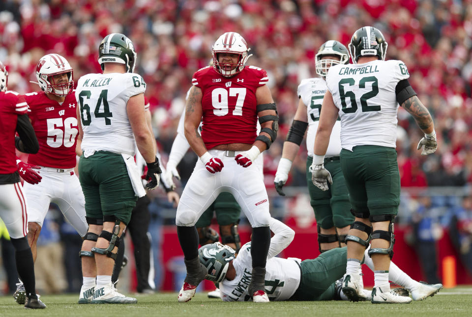 Oct 12, 2019; Madison, WI, USA; Wisconsin Badgers defensive end Isaiahh Loudermilk (97) celebrates after tackling Michigan State Spartans quarterback Brian Lewerke (14) during the third quarter at Camp Randall Stadium. Mandatory Credit: Jeff Hanisch-USA TODAY Sports
