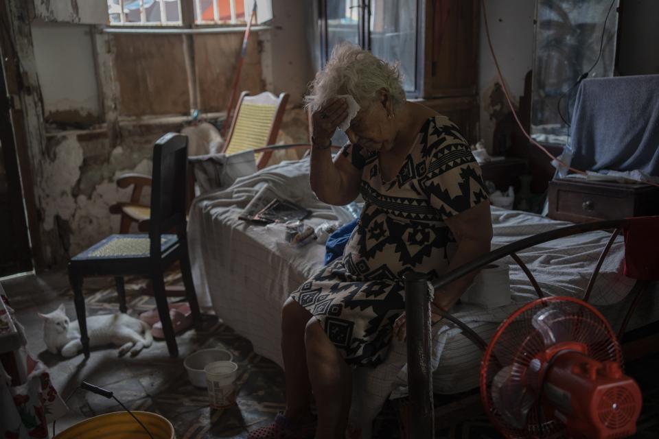 Margarita Salazar, 82, wipes the sweat off with a tissue inside her home amid high heat in Veracruz, Mexico, on June 16, 2024. Human-caused climate change intensified and made far more likely this month's killer heat with triple digit temperatures, a new flash study found Thursday, June 20. (AP Photo/Felix Marquez)