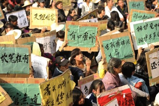 Local residents are seen here during a rally in Wukan, a fishing village in the southern province of Guangdong on December 17. Protesting villagers say they will march on government offices this week unless the body of a local leader is released and four villagers in police custody are freed