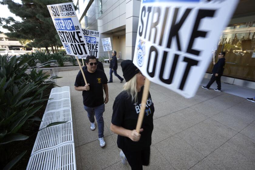 Members with Teamsters Local 2010 join the California Faculty Association (CFA) and other California State University (CSU) unions at a rally outside the CSU Chancellor's Office in Long Beach, Calif., on Tuesday, Nov. 14, 2023. (AP Photo/Damian Dovarganes)