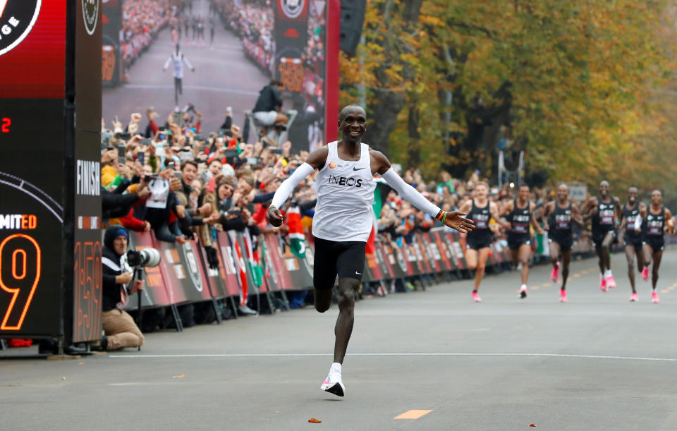 Kenya's Eliud Kipchoge, the marathon world record holder, crosses the finish line during his attempt to run a marathon in under two hours in Vienna, Austria, October 12, 2019. REUTERS/Leonhard Foeger