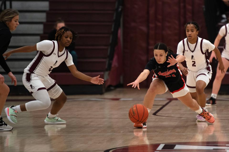 Pennsbury junior Sofia Vitucci reaches for a loose ball at Abington Senior High School on Wednesday, Feb. 22, 2023. The Ghosts fell to the Falcons at the District One second-round playoff game, 51-39.