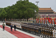 Chinese President Xi Jinping and Russian President Vladimir Putin review the honor guard during an official welcome ceremony in Beijing, China, Thursday, May 16, 2024. (Sergei Bobylev, Sputnik, Kremlin Pool Photo via AP)