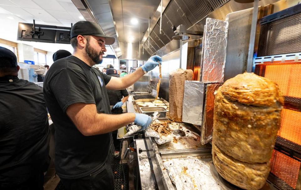 Nick Tsigaris helps out during the grand opening of Nick the Greek restaurant in Riverbank, Calif., Tuesday, September 12, 2023. Andy Alfaro/aalfaro@modbee.com