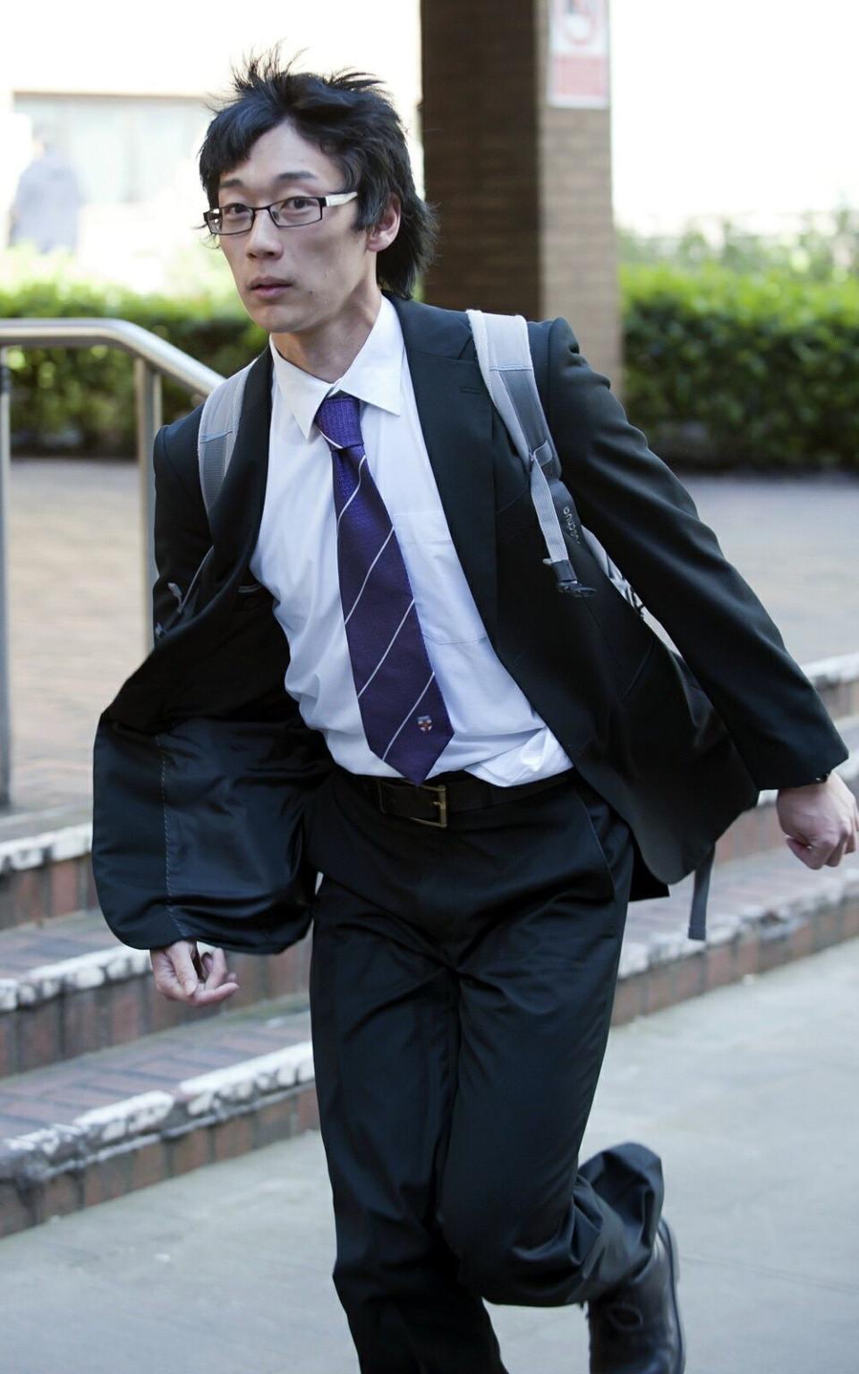 Statistician Sherman Ip was pictured leaving court on Wednesday  - Credit: central news