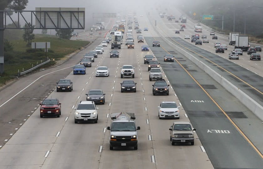 SAN DIEGO, CA - AUGUST 26: Commuters travel during morning commute hours along northbound Interstate 805 (left) north of Governor Drive on Wednesday, Aug. 26, 2020 in San Diego, CA. (Eduardo Contreras / The San Diego Union-Tribune)