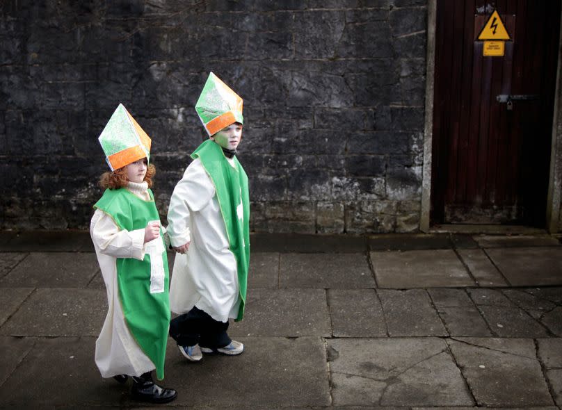 Children make their way to the St Patrick's Day parade during the St Patrick's Day celebrations in Limerick, Ireland, Sunday, March 17, 2013.