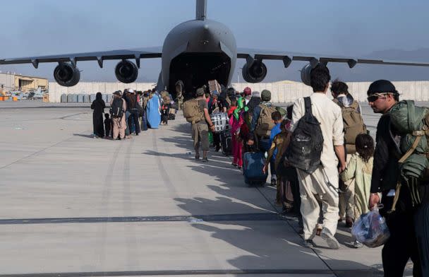 PHOTO: U.S. Air Force loadmasters and pilots load passengers aboard a U.S. Air Force C-17 Globemaster III in support of the Afghanistan evacuation at Hamid Karzai International Airport in Kabul, Afghanistan, Aug. 24, 2021. (Master Sgt. Donald R. Allen/U.S. Air Force)