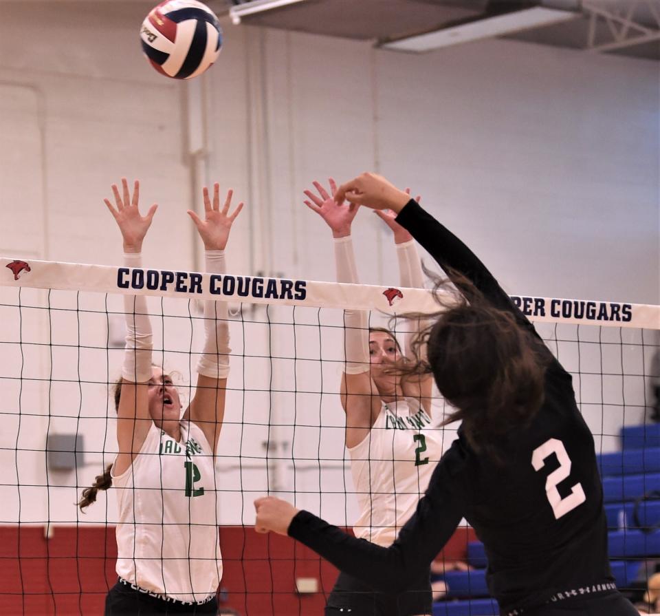 Wall's Savannah Hartman, left, and Kippy Pickens defend as Wylie's Taylar Riley hits a shot. Wylie beat the Lady Hawks 25-18, 25-12 in the third-place match at the Bev Ball Classic on Saturday at Cooper's Cougar Gym.