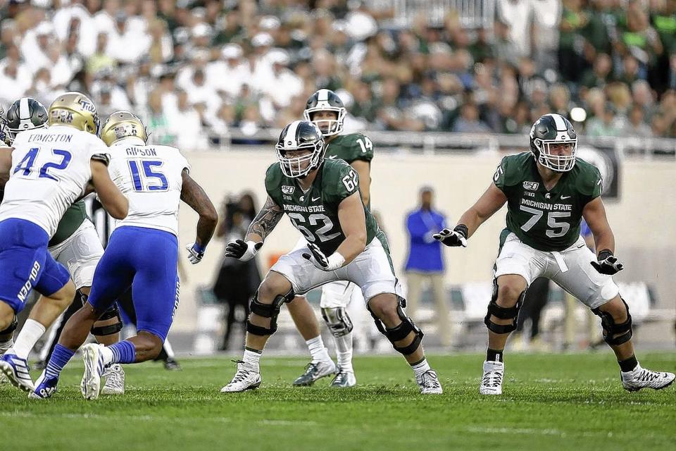 Luke Campbell (62) missed six games and Kevin Jarvis (75) sat out 14 over the past two seasons along Michigan State's offensive line.