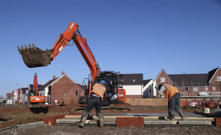 Construction workers work on a Taylor Wimpey housing estate in Aylesbury, Britain, February 7, 2017. REUTERS/Eddie Keogh