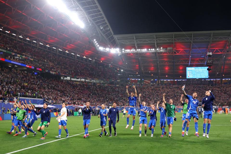 Italy are delirious as they celebrate qualifying for the knockout stage  (Getty Images)