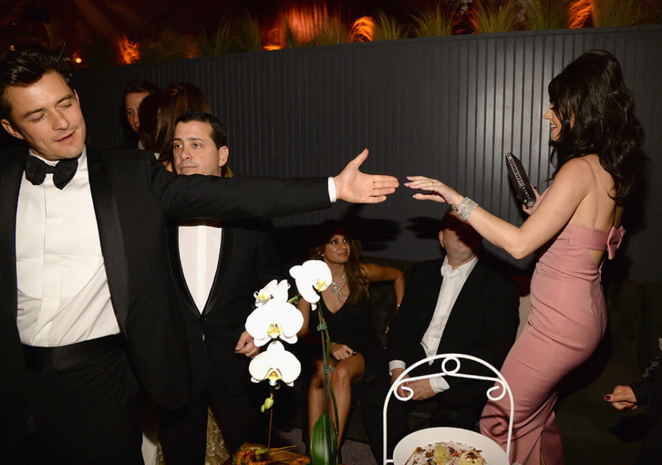 Bloom, who split from wife Miranda Kerr in October 2013, even hit the dance floor with Perry, John Mayer’s on-again/off-again love since 2012, in full view of cameras. (Photo: Kevin Mazur/Getty Images for The Weinstein Company)