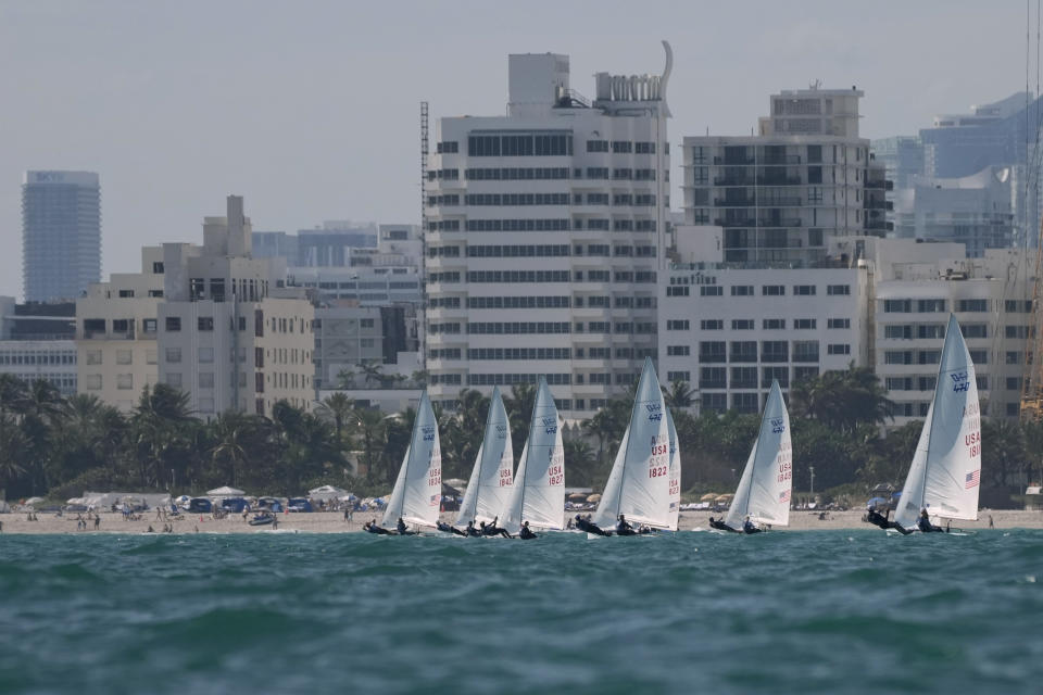 Lara Dallman-Weiss and Stu McNay (1842) campaign in the mixed-gender 470 category at U.S. Sailing Olympic Trials, off the coast of Miami Beach, Fla., Friday, Jan. 12, 2024. McNay is returning for his fifth Olympics and teaming up with Dallman-Weiss, who competed in the women's 470 in the Tokyo Games, in the new mixed-gender category. (AP Photo/Rebecca Blackwell)