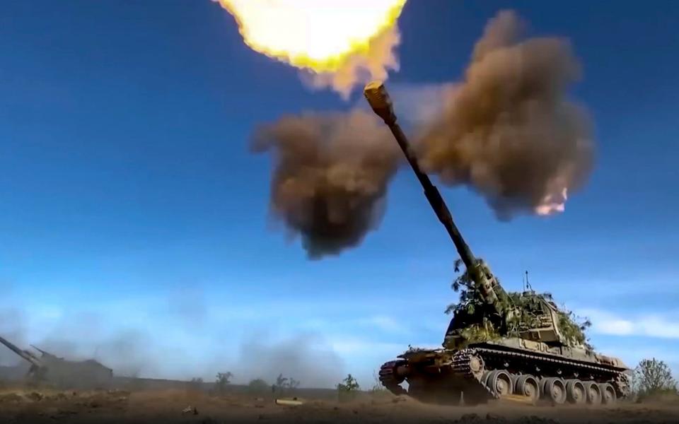 This photo taken from video released by Russian Defense Ministry Press Service on Monday, June 5, 2023 shows a Russian self-propelled gun firing towards Ukrainian positions at an undisclosed location. - Russian Defense Ministry Press Service