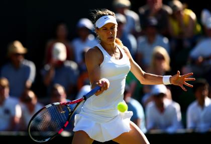 LONDON, ENGLAND - JUNE 30:  Eugenie Bouchard of Canada in action in her Ladies Singles first round match against Ying-Ying Duan of China during day two of the Wimbledon Lawn Tennis Championships at the All England Lawn Tennis and Croquet Club on June 30, 2015 in London, England.  (Photo by Clive Brunskill/Getty Images)