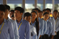 Cambodian students enter into the courtroom before the hearings against two former Khmer Rouge senior leaders, at the U.N.-backed war crimes tribunal on the outskirts of Phnom Penh, Cambodia, Friday, Nov. 16, 2018. The U.N.-backed tribunal judging the criminal responsibility of former Khmer Rouge leaders for the deaths of an estimated 1.7 million Cambodians will issue verdicts Friday in the latest — and perhaps last — of such trials. (AP Photo/Heng Sinith)