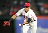 Apr 1, 2019; Arlington, TX, USA; Texas Rangers first baseman Ronald Guzman (11) throws to first base during the game against the Houston Astros at Globe Life Park in Arlington. Mandatory Credit: Kevin Jairaj-USA TODAY Sports