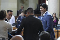 Los Angeles Dodgers baseball star Shohei Ohtani, right, is honored Friday, May 17, 2024, during a council meeting in Los Angeles. (AP Photo/Damian Dovarganes)