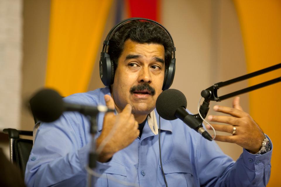 Venezuela's President Nicolas Maduro speaks during a radio and television program called "In contact with Maduro", at the Miraflores presidential palace in Caracas, Venezuela, Tuesday, March 11, 2014. Venezuelan President Nicolas Maduro canceled plans to be at the innauguration of Chile's President Michelle Bachelet, after Biden called the street protests in Venezuela "alarming" and said democratically elected leaders who rule as authoritarians damage their people and countries. (AP Photo/Alejandro Cegarra)