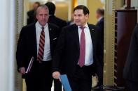 Senators Sullivan and Rubio walk to the Senate Chamber during a break as the Trump impeachment trial continues in Washington.