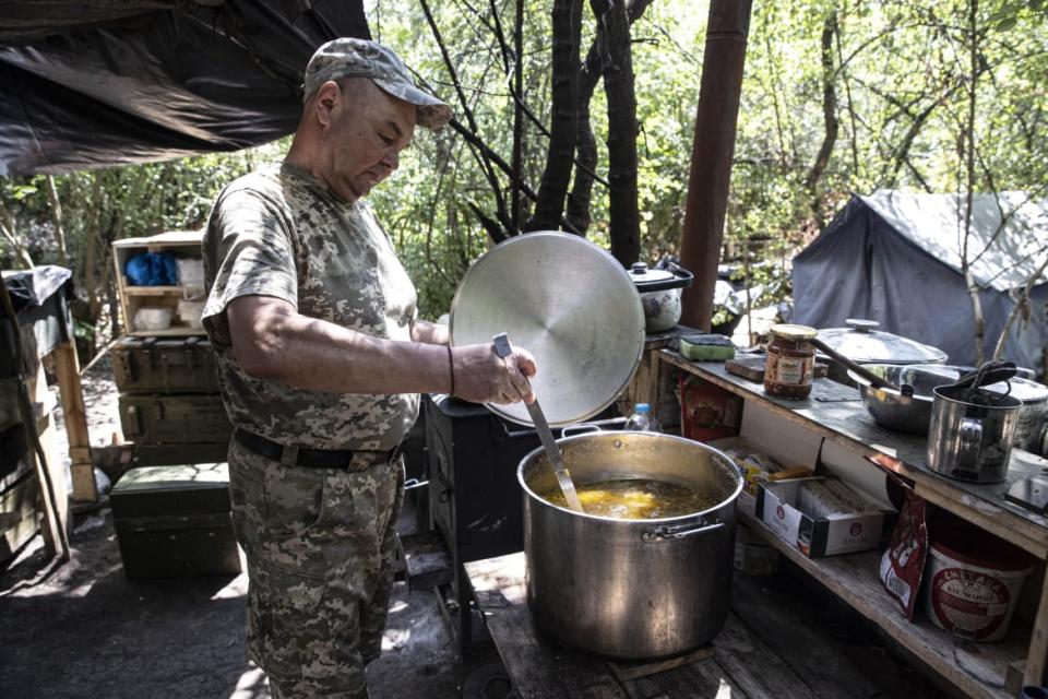 <div class="inline-image__caption"><p>Valodya, a 49-year-old man, volunteers as a cook for Ukrainian soldiers in Kherson, Kherson Oblast, Ukraine.</p></div> <div class="inline-image__credit">Metin Aktas/Anadolu Agency via Getty</div>