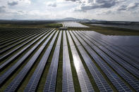 A solar plant sits in Pavagada Tumkur district, in the southern Indian state of Karnataka, India, Thursday, Sept. 15, 2022. India is investing heavily in renewable energy and has committed to producing 50% of its power from clean energy sources by 2030. (AP Photo/Rafiq Maqbool)